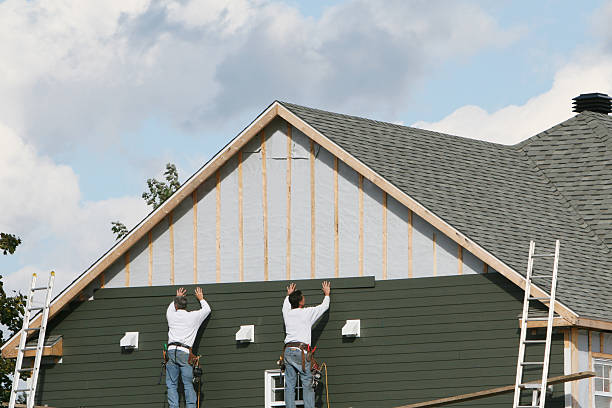 Professional Siding technician working in Windham, OH